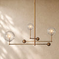Glass Globe Mobile Three-Arm Chandelier - Lacquered Burnished Brass