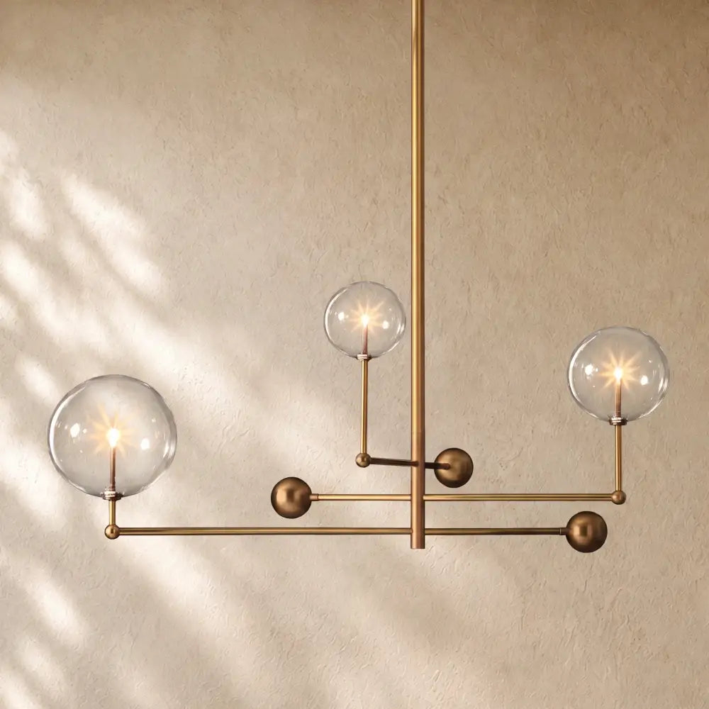 Glass Globe Mobile Three-Arm Chandelier - Lacquered Burnished Brass